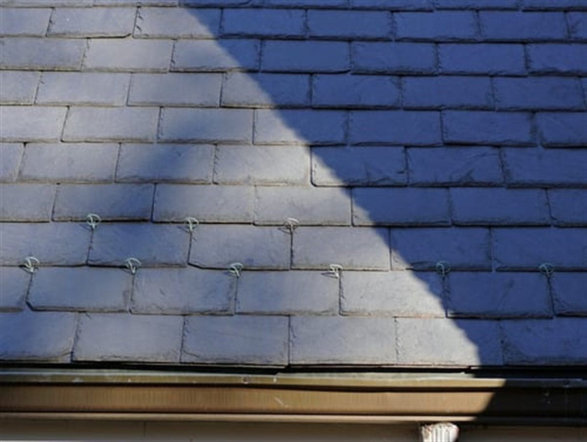 Home exterior being washed and prepared ahead of a repaint